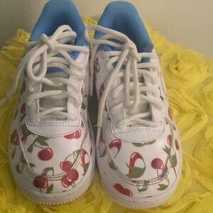 Nike Kids Sneakers with Cherry Design and Blue Highlights